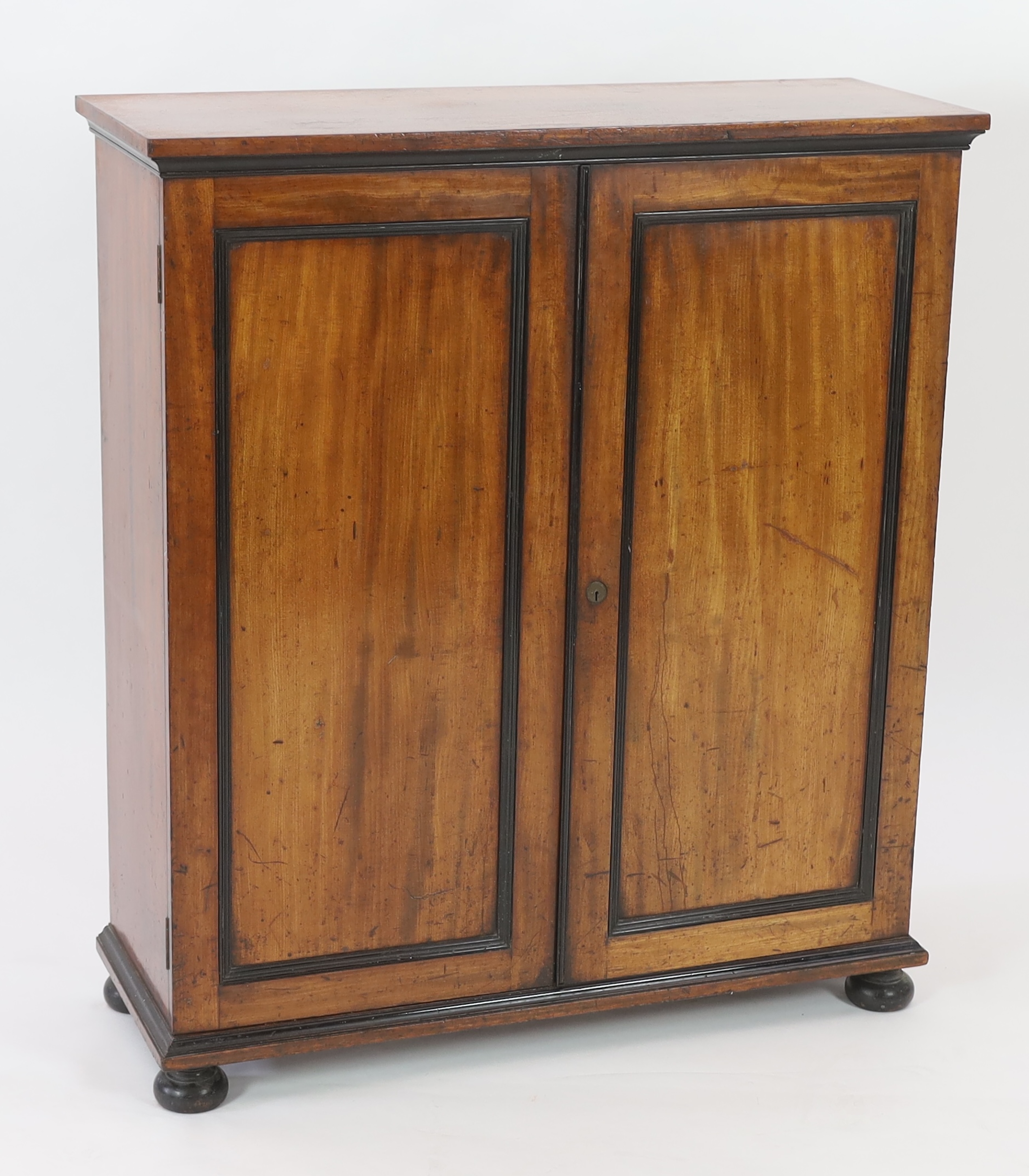 An unusual William IV ebony and mahogany cigar cabinet